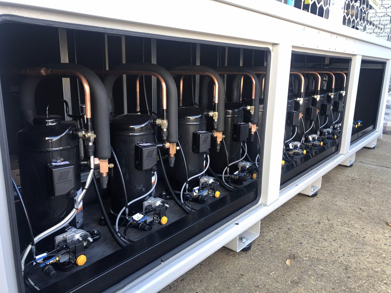 Multi-Compressor Rack - Bank of compressors with piping inside packaged condensing unit