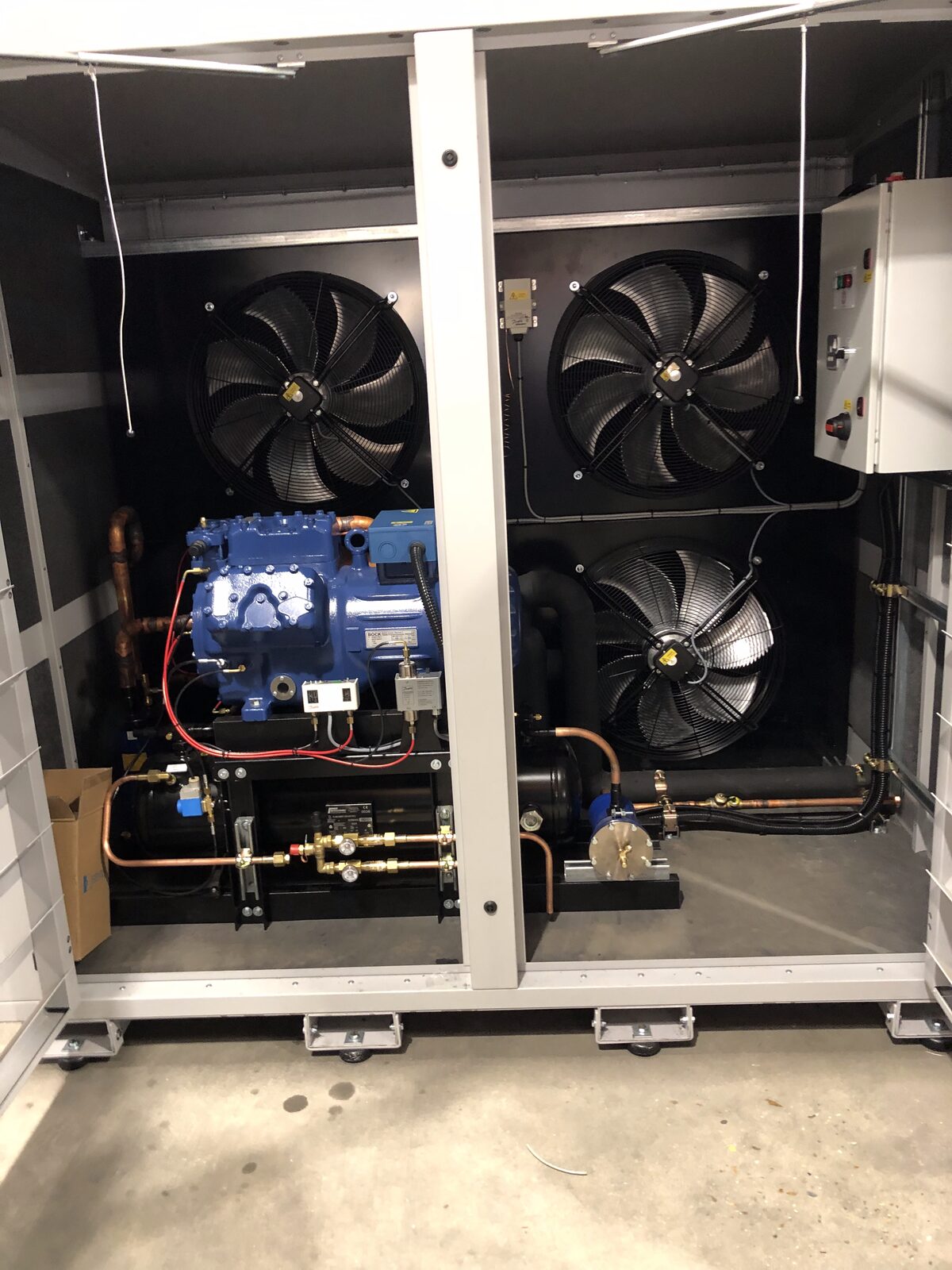 Compressor Pack - Bock compressor and condenser fans inside packaged refrigeration unit